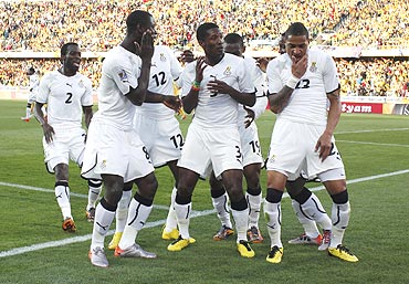 Gyan (centre) dances with his Ghana teammates