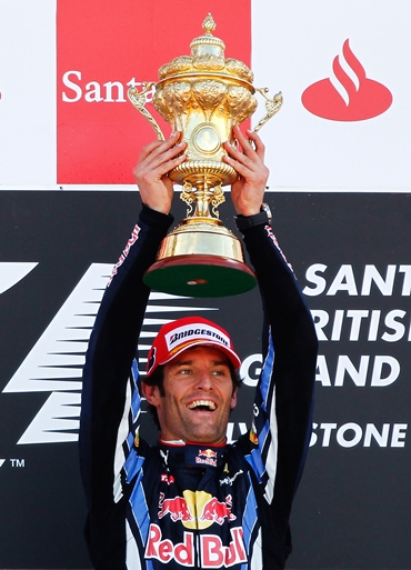 Australia's Mark Webber celebrates his triumph