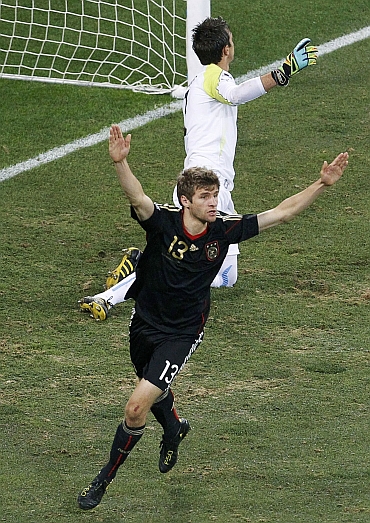 Germany's Thomas Mueller celebrates after scoring the first goal