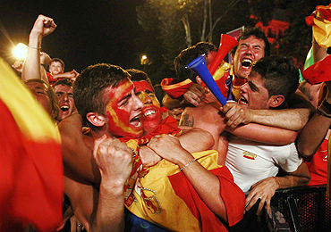 Spanish fans celebrate after the World Cup victory in Madrid