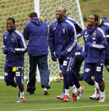 France captain Patrice Evra (left) with Nicolas Anelka (centre) and Florent Malouda train during the 2010 World Cup