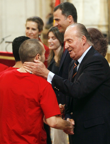 Spain's King Juan Carlos greets national soccer team player Andres Iniesta during a reception at Madrid's Royal Palace