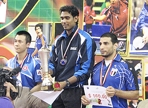Sharath Kamal on the podium after winning the Egypt Open