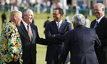 Tiger Woods (centre) chats with John Daly, Mark Calcavecchia, Lee Trevino and Tom Weiskopf before a photo-op atthe Old Course in St Andrews, Scotland