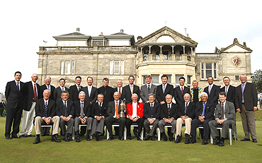 Past winners of the British Open golf championship pose in front of the clubhouse on the Old Course in St Andrews