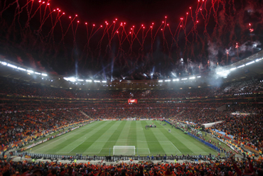 Fireworks explode over the Soccer City stadium during celebrations after the 2010 World Cup final match