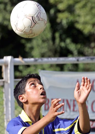 A young boy trains at the polo ground in Srinagar
