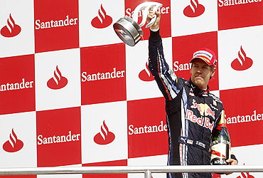 Red Bull's Sebastian Vettel celebrates on the podium