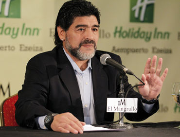 Argentina's former national soccer team coach Maradona reads a statement in Buenos Aires