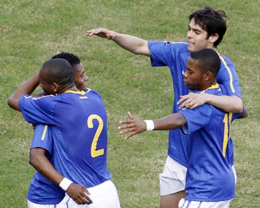 Brazilian players celebrate after scoring against Zimbabwe during a friendly match