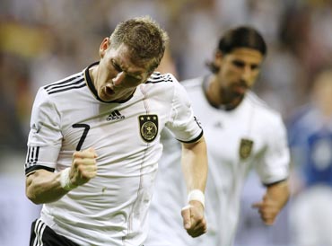 Bastian Schweinsteiger celebrates after scoring against Bosnia