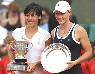 Francesca Schiavone (left) and Samantha Stosur with their trophies after the presentation ceremony
