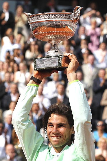 Rafael Nadal holds aloft his trophy after winning the French Open final on Sunday
