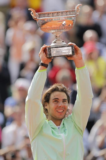 Rafael Nadal lifts the French Open trophy after beating Robin Soderling
