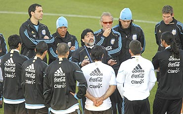 Argentina's coach Diego Maradona speaks with players during a training session in Pretoria