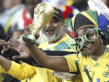 A South African fan cheers during a practice match