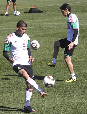 Mexico's Ricardo Osorio (left) and Guillermo Franco go through the gring during a practice session