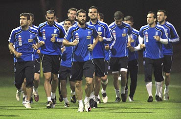The Greek football team go through the motions during a training session