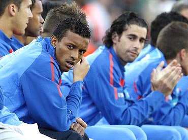Portugal's Nani (left) watches the match from the bench