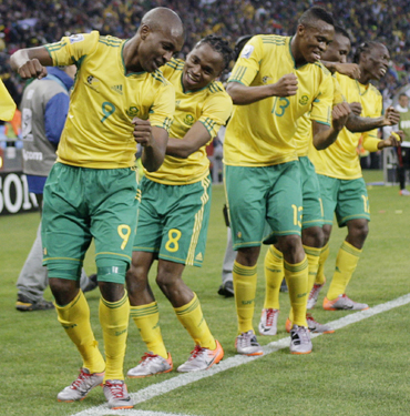 -South Africa's Siphiwe Tshabalala dances with team mates