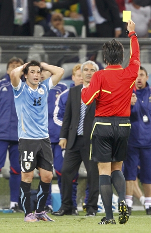 Lodeiro reacts as referee Nishimura shows him his second yellow card