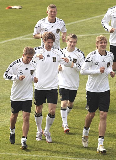 Germany's players warm up during a training session in Pretoria