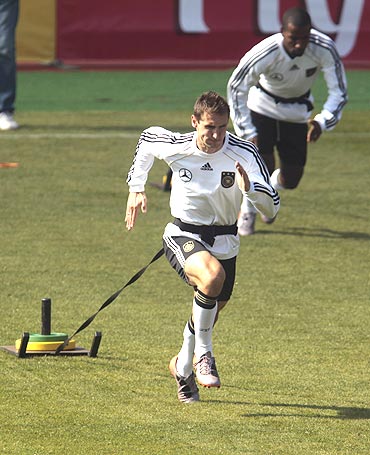 Germany's Miroslav Klose and Cacau (right) go through the grind during a training session in Pretoria