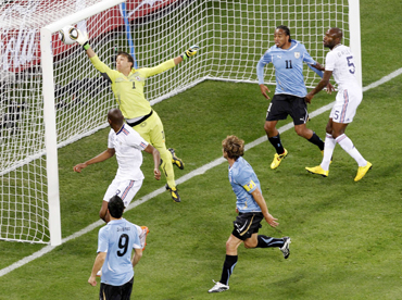 Uruguay's goalkeeper Muslera clears the ball during the 2010 World Cup Group A soccer match against France