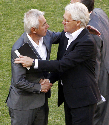 Denmark's coach Morten Olsen shakes hands with the Netherlands' coach Bert van Marwijk during a 2010 World Cup