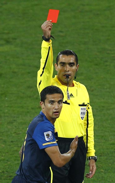 Australia's Tim Cahill reacts after getting a red card