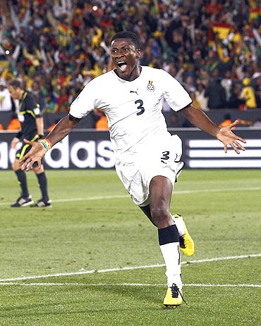 Ghana's Asamoah Gyan celebrates after conveting a penalty against Serbia
