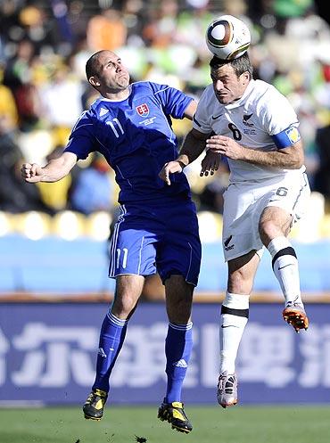 New Zealand's Ryan Nelsen (right) and Slovakia's Robert Vittek are involved in an aeriel duel