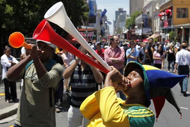 Fan blowing Vuvuzela trumpet ahead of South Africa match