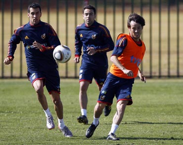 Spain's Sergio Busquets, Xavi and David Silva during a training session
