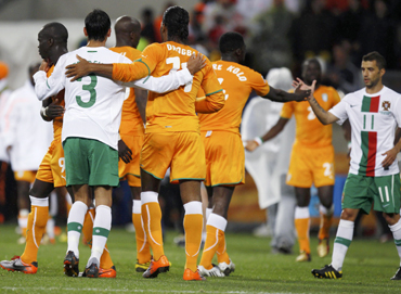 Portugal and Ivory Coast players greet each other at the end of a 2010 World Cup Group G soccer match in Port Elizabeth