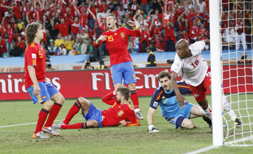 Spain players react after Switzerland's Fernandes scored during the 2010 World Cup Group H match