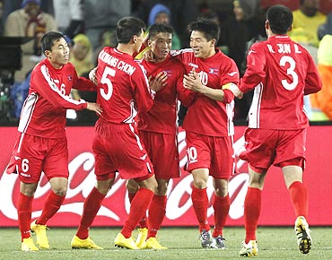 North Korea's Ji Yun-nam (centre) celebrates with team-mates after scoring against Brazil