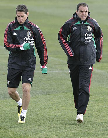 Mexican striker Cuauhtemoc Blanco (right) and team-mate Guillermo Franco go through the grind at a training camp