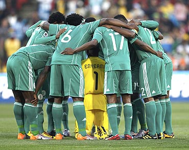 Nigerian players form a huddle before the match against Argentina played last week