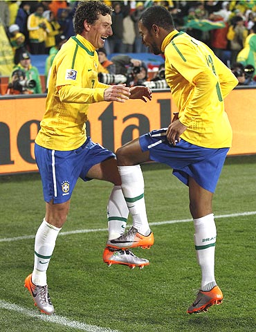 Brazil's Elano (left) and Robinho break into a jig in celebration
