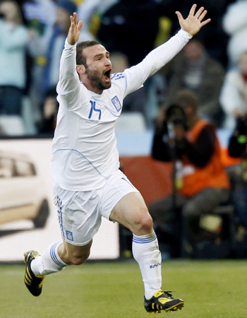 Dimitris Salpigidis celebrates after scoring Greece's first ever World Cup goal