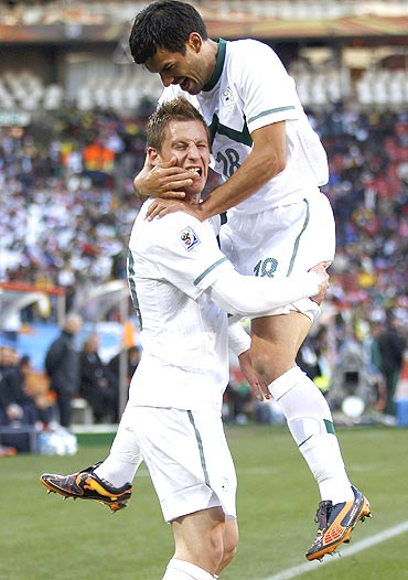 Slovenia's Valter Birsa (left) celebrates with teammate Aleksander Radosavljevic after scoring