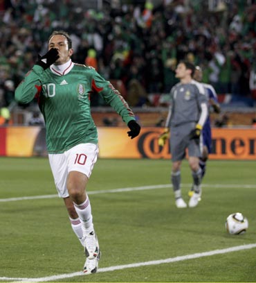 Mexico's Cuauhtemoc Blanco celebrates after scoring a penalty against France