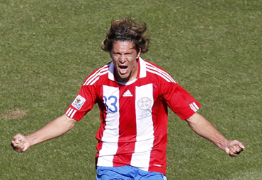Paraguay's Enrique Vera celebrates after scoring a goal during their 2010 World Cup Group F soccer match against Slovakia
