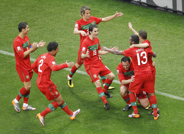 Portugal's Hugo Almeida celebrates his goal with team mates during the 2010 World Cup Group G match against North Korea
