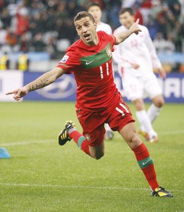 -Portugal's Simao Sabrosa celebrates his goal during the 2010 World Cup Group G soccer match against North Korea