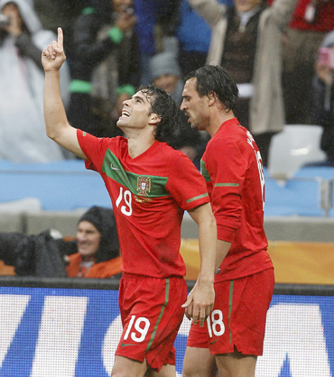 Portugal's Tiago celebrates his goal next to team mate Almeida during the 2010 World Cup Group G soccer match