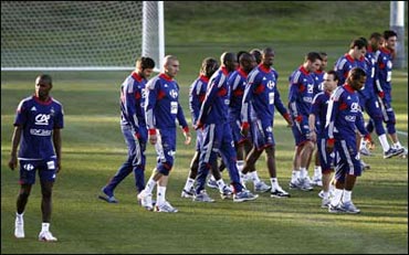 French players leave the field after refusing to take part in a training session on Sunday