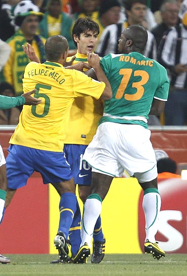 Brazil's Kaka (centre) argues with Ivory Coast's Romaric (right) as Felipe Melo tries to seperate the two