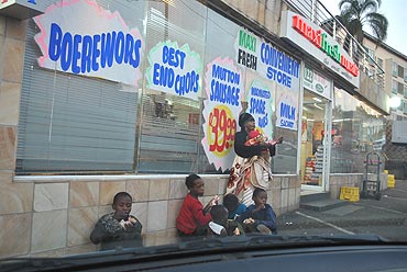 Poor folk at a street corner in Durban